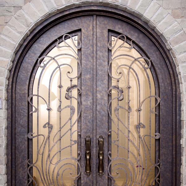 Farmhouse iron door with arched top and privacy glass