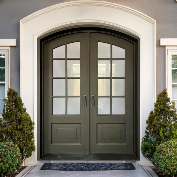 Farmhouse iron entry door with arched top and privacy glass