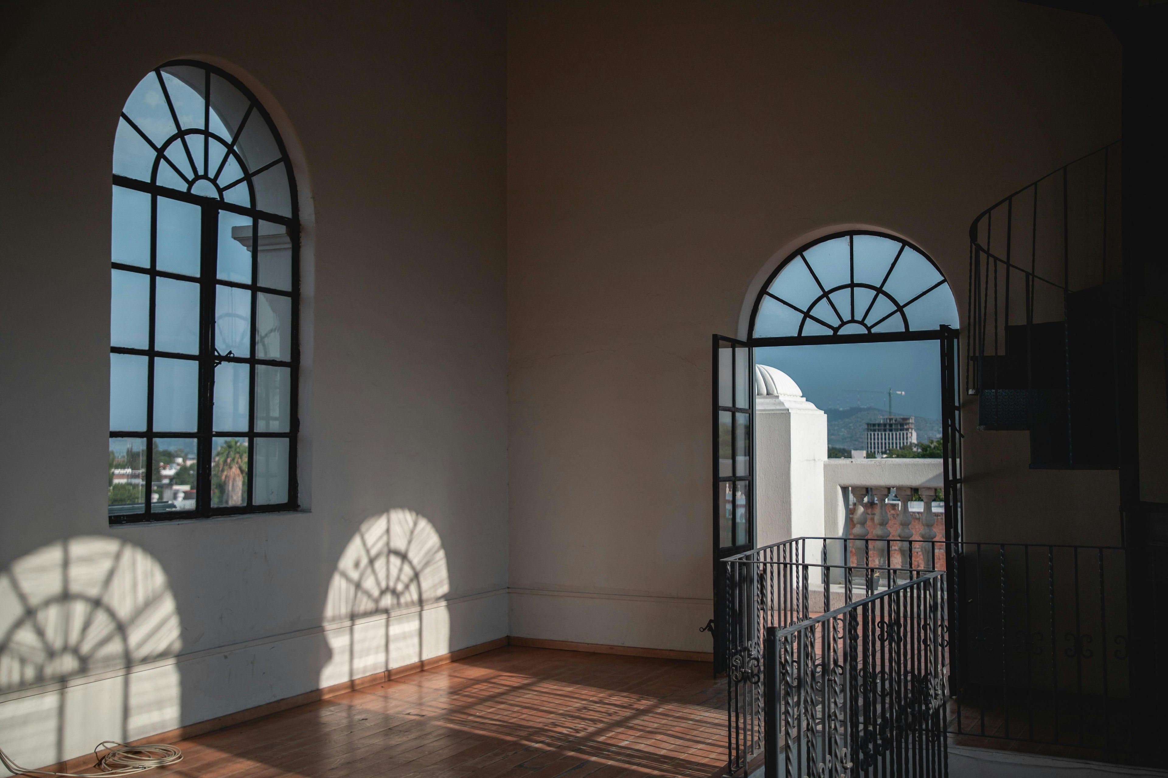 Slim-line minimal iron doors in matte black with full glass